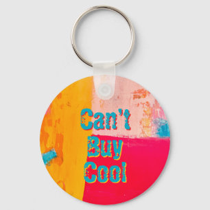 Beachy key chain says “can’t buy cool”