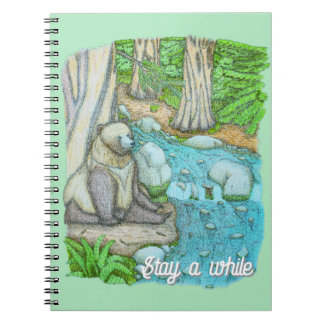 Bear sitting by a creek notebook