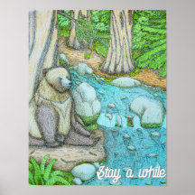 Bear sitting by a creek