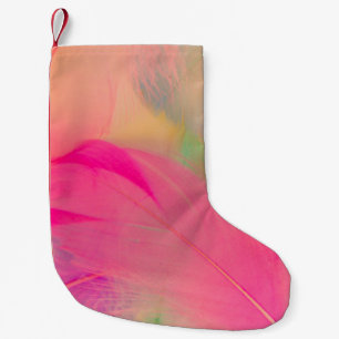 Beautiful abstract purple and blue feathers on whi small christmas stocking