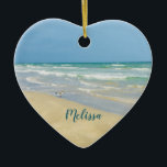 Beautiful Beach Photo Personalised Heart Christmas Ceramic Tree Decoration<br><div class="desc">Beautiful heart shaped beach ornament with gorgeous seaside photography featuring a pretty sandpiper standing at the edge of the ocean waves on a sunny summer day. Lovely blue green water waves roll onto the sandy shore where your name is personalised in cute teal typography. A beautiful Christmas gift for a...</div>