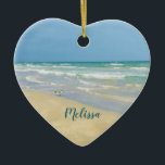 Beautiful Beach Photo Personalised Heart Christmas Ceramic Tree Decoration<br><div class="desc">Beautiful heart shaped beach ornament with gorgeous seaside photography featuring a pretty sandpiper standing at the edge of the ocean waves on a sunny summer day. Lovely blue green water waves roll onto the sandy shore where your name is personalised in cute teal typography. A beautiful Christmas gift for a...</div>