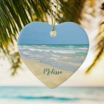 Beautiful Beach Photo Personalised Heart Christmas Ceramic Tree Decoration<br><div class="desc">Beautiful heart shaped beach ornament with gorgeous seaside photography featuring a pretty sandpiper standing at the edge of the ocean waves on a sunny summer day. Lovely blue green water waves roll onto the sandy shore where your name is personalised in cute teal typography. A beautiful Christmas gift for a...</div>