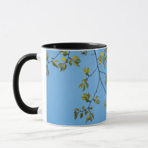 beautiful branch with green and yellow leaves hug mug
