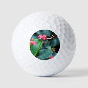 Beautiful butterfly on a pink flower golf balls