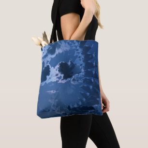 Beautiful cloudy skies over the mountains.... tote bag