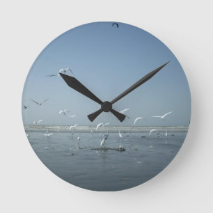 Beautiful Cranes Flying Over Water Nature's Ballet Round Clock