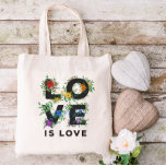 Beautiful Floral Love Is Love Pride Tote Bag<br><div class="desc">Pride tote bag with LOVE IS LOVE written in bold black letters decorated with greenery,  berries,  and flowers in red,  orange,  yellow,  green,  blue,  and purple,  inspired by the rainbow pride flag colours.</div>