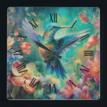 Beautiful Hummingbird Surrounded by Flowers Square Wall Clock<br><div class="desc">Surrounded by flowers,  a beautiful hummingbird with a Roman numeral face.</div>