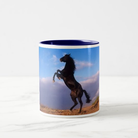 Beautiful rearing black horse with blue sky photo Two-Tone coffee mug