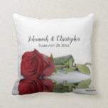 Beautiful Red Rose Wedding Memento Cushion<br><div class="desc">This beautiful throw pillow is a perfect way to commemorate your special day. It features a beautiful design with a single long stemmed red rose reflecting in a pool of water with ripples and waves. Above are the names of the couple in lacy script calligraphy,  and the wedding date.</div>