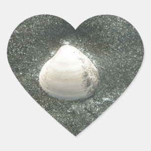 Beautiful Seashell in the Sand: A Salty Souvenir Heart Sticker