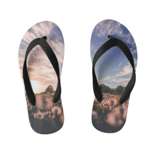 beautiful sky over the plain kid's flip flops