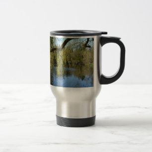 beautiful spring willow trees by water pond. travel mug