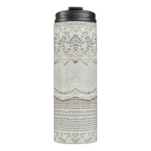 Beautiful, subtle, white laced textile close up.  thermal tumbler