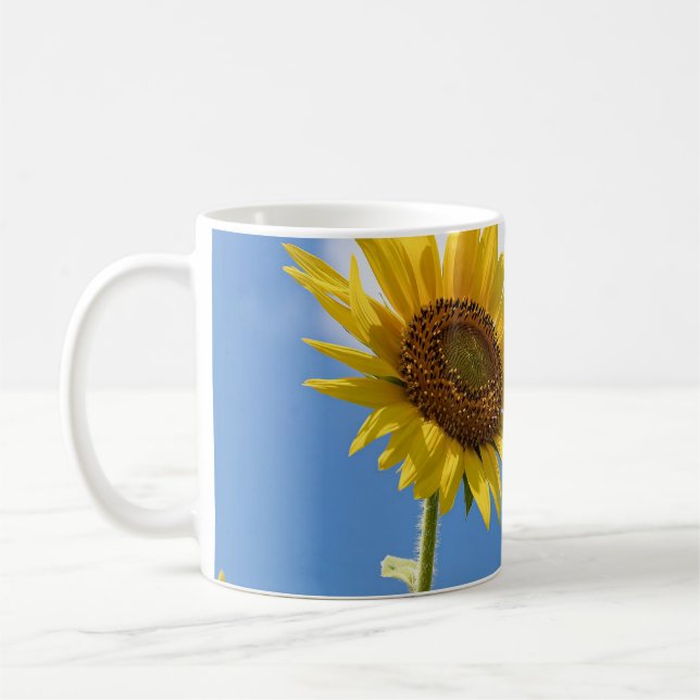 beautiful sun flowers with cloudy blue sky coffee mug (Left)