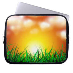 Beautiful Sunrise Over a Field of Grass Laptop Sleeve
