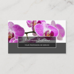 Beautiful violet pink orchid blossoms on grey business card