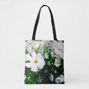 Beautiful white cosmos flowers blooming in gardena tote bag