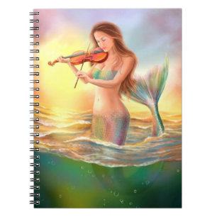 Beautiful woman fantasy mermaid plays on violin notebook