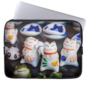 Beckoning cat figurines laptop sleeve