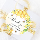 Bee Bridal shower yellow floral thank you  Classic Round Sticker<br><div class="desc">A stylish white and golden watercolored background.  Decorated with bumble bees,  melting honey and honeycomb with yellow florals,  flowers and a honey jar.   The text: thank you with a black hand lettered style script with swashes.  Personalise and add a name and text. For bridal shower party favours.</div>