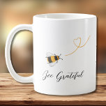 Bee Coffee Mug<br><div class="desc">This coffee mug is decorated with watercolor honey bees and "Bee Grateful" in stylish script typography.
Easily customisable with your monogram.
Original Watercolor © Michele Davies.</div>