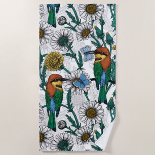 Bee-eaters, blue butterflies and daisies on white beach towel