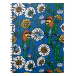 Bee eaters on blue notebook