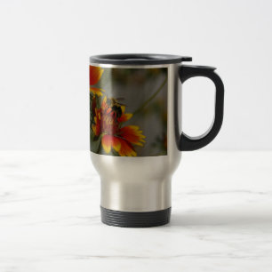 Bee foraging on a flower travel mug