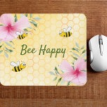 Bee Happy bumble bees yellow honeycomb floral Mouse Mat<br><div class="desc">Yellow,  white background with a honeycomb pattern. Decorated with pink tropical florals flowers,  hibiscus and happy bumble bees. The text: Bee Happy in green hand lettered style script. Perfect for your summer home work space,  office!</div>