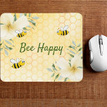 Bee Happy bumble bees yellow honeycomb summer Mouse Mat<br><div class="desc">Yellow,  white background with a honeycomb pattern. Decorated with light yellow,  cream coloured tropical florals flowers,  hibiscus and happy bumble bees. The text: Bee Happy in green hand lettered style script. Perfect for your summer home work space,  office!</div>