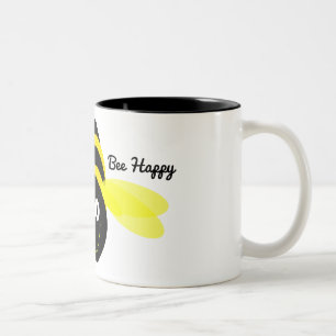 Bee Happy cartoon on a white mug black inside.