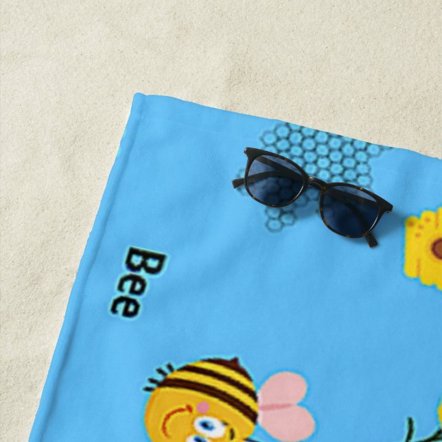 Bee pattern on blue beach towel (In Situ)