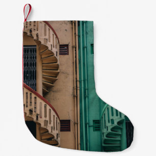 Beige and green concrete spiral stairs beside buil small christmas stocking