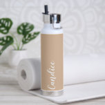 Beige Personalised Wedding Bridesmaid Water Bottle<br><div class="desc">Gift your wedding bridesmaid or maid of honour with this trendy, vacuum Insulated water bottle that features her name in white, stylised script on a beige colour background designed to match your wedding colour scheme. Personalise bottle by editing and replacing name with your own as desired. Select your water bottle...</div>