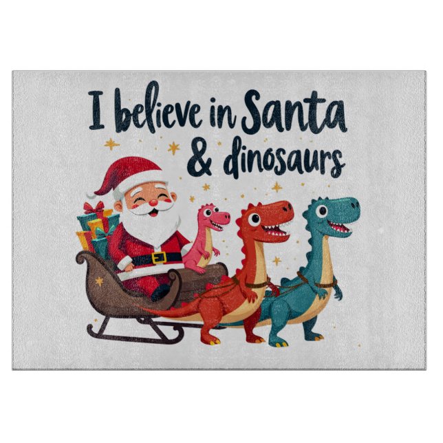 believe in Santa and dinosaurs (Santa riding dinos Cutting Board (Front)