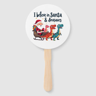 believe in Santa and dinosaurs (Santa riding dinos Hand Fan
