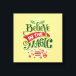 Believe in the Magic Christmas Typography Canvas Print<br><div class="desc">Canvas print with a cool illustration. Text says Believe in the Magic in fancy lettering. Decorated with christmas balls.</div>
