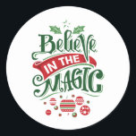 Believe in the Magic Christmas Typography Classic Round Sticker<br><div class="desc">Stickers with a cute illustration. Text says Believe in the Magic in fancy lettering. Decorated with christmas balls.</div>