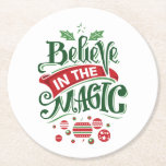Believe in the Magic Christmas Typography Round Paper Coaster<br><div class="desc">Paper coasters with a cool illustration. Text says Believe in the Magic in fancy lettering. Decorated with christmas balls.</div>