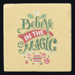 Believe in the Magic Christmas Typography Stone Coaster<br><div class="desc">A stone coaster with a cool illustration. Text says Believe in the Magic in fancy lettering. Decorated with christmas balls.</div>