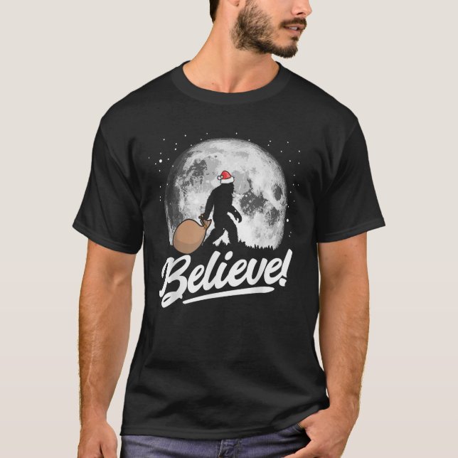 Believe Santa Bigfoot Christmas Snow Moon Night Gr T-Shirt (Front)