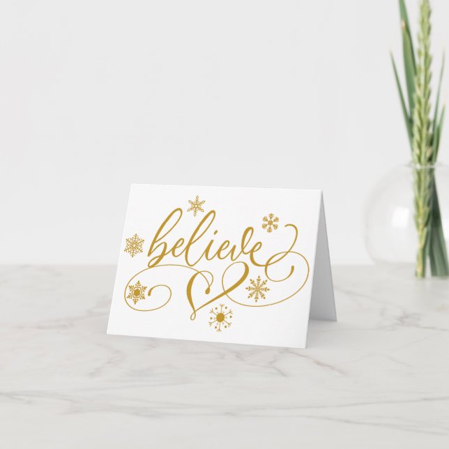 Believe Script | Gold Snowflake Flourish Christmas Holiday Card (Front)