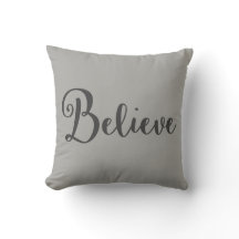 "Believe" Text in Dark Grey on Grey Pillow