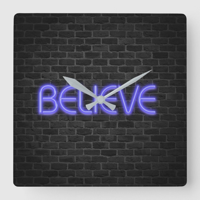 Believe text in neon lighting on brick square wall clock (Front)
