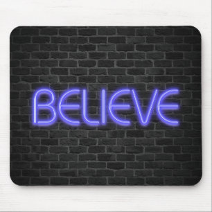 Believe text in neon lights on brick mouse mat