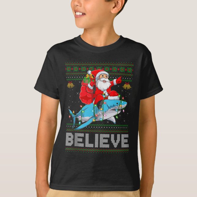 Believe Xmas Funny Santa Riding Shark Ugly Christm T-Shirt (Front)