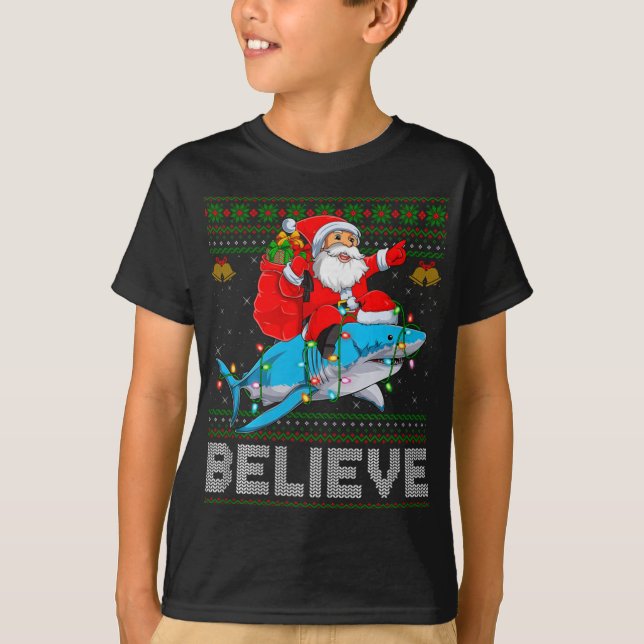 Believe Xmas Funny Santa Riding Shark Ugly Christm T-Shirt (Front)