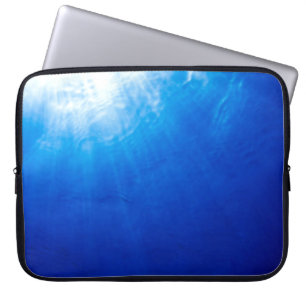 Below beneath blue deep dive laptop sleeve